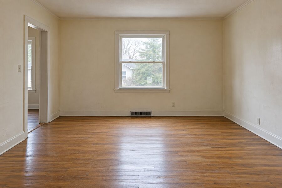 The same room emptied and swept broom-clean