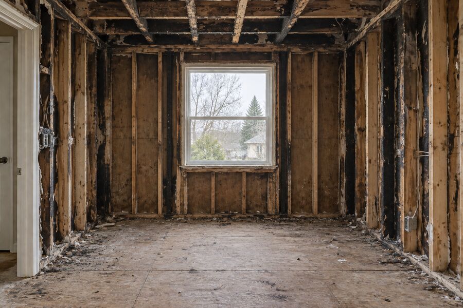 A room gutted to the studs and joists after a fire