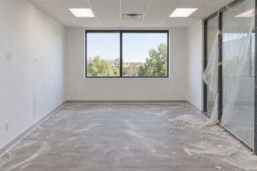 An office after renovation with drywall dust over every surface