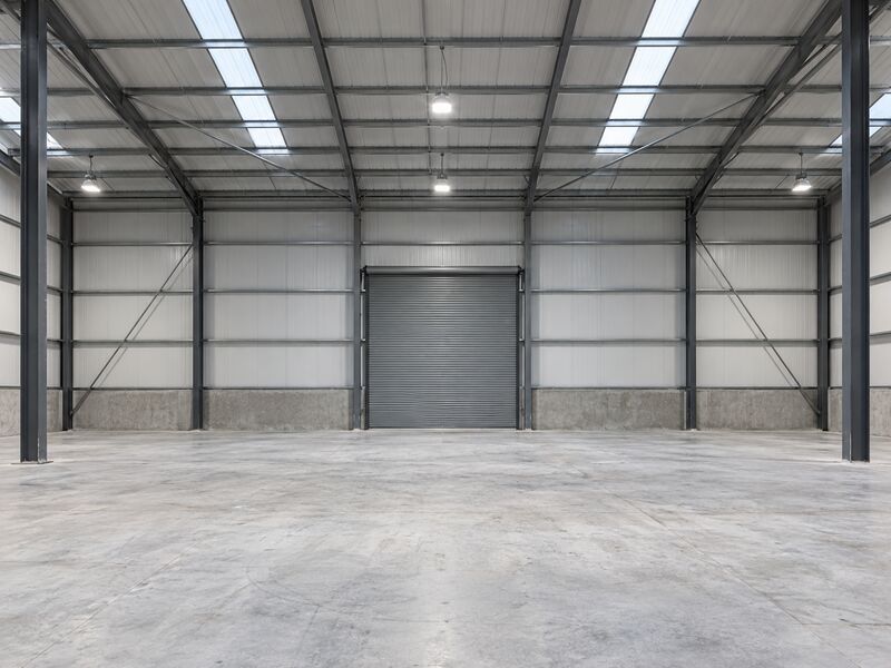 A new industrial space with bare concrete and exposed steel structure
